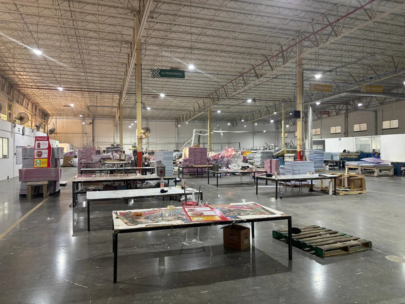 Cassium production floor with work tables and finished corrugated sheet